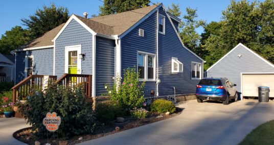 Blue Siding on house and garage