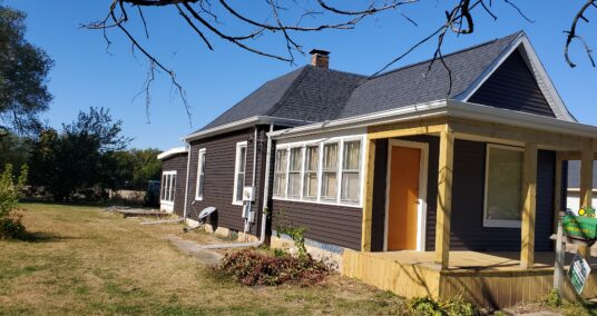 New siding & roof on one story home