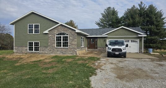 New windows and sage green siding