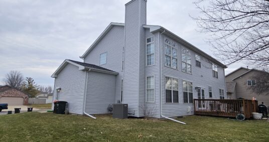 New white siding on 2 story home