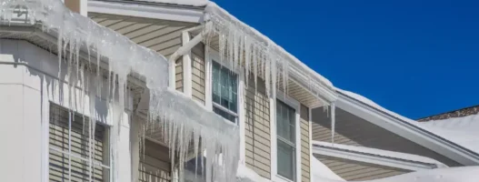 An ice dam on a roof that could have been prevented with exterior remodeling Peoria IL