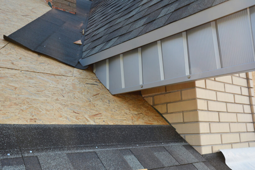 A close-up on unfinished attic roofing construction with fascia board and plywood sheathing covered with asphalt shingles using waterproofing underlayment and flashing in the roofing corners, siding contractors East Peoria IL, siding company East Peoria IL, vinyl siding East Peoria IL, siding installation East Peoria IL, siding replacement East Peoria IL, siding contractors near East Peoria IL, house siding contractors East Peoria IL, exterior remodeling East Peoria IL, soffit and fascia East Peoria IL, vinyl siding contractors East Peoria IL, siding repair East Peoria IL, home siding replacement East Peoria IL, insulated siding East Peoria IL, residential siding contractor East Peoria IL, low maintenance siding East Peoria IL, siding installers East Peoria IL, curb appeal siding East Peoria IL, siding estimate East Peoria IL, Norandex siding East Peoria IL, Mastic siding East Peoria IL, siding services East Peoria IL