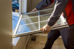 Worker in the removing break down, windows in the home renovation living energy efficiency, window installers Peoria IL, window replacement Peoria IL, replacement windows Peoria IL, window contractor Peoria IL, vinyl windows Peoria IL, window installation Peoria IL, energy efficient windows Peoria IL, double hung windows Peoria IL, casement windows Peoria IL, awning windows Peoria IL, sliding windows Peoria IL, bay windows Peoria IL, bow windows Peoria IL, picture windows Peoria IL, Vinyl Kraft windows Peoria IL, residential window installers Peoria IL, home window replacement Peoria IL, window company Peoria IL, custom windows Peoria IL, new windows Peoria IL, window services Peoria IL
